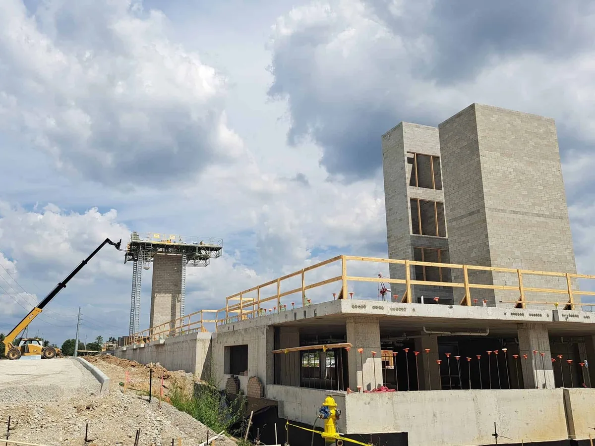 Concrete block stair and elevator tower rising on a new commercial building, commercial masonry